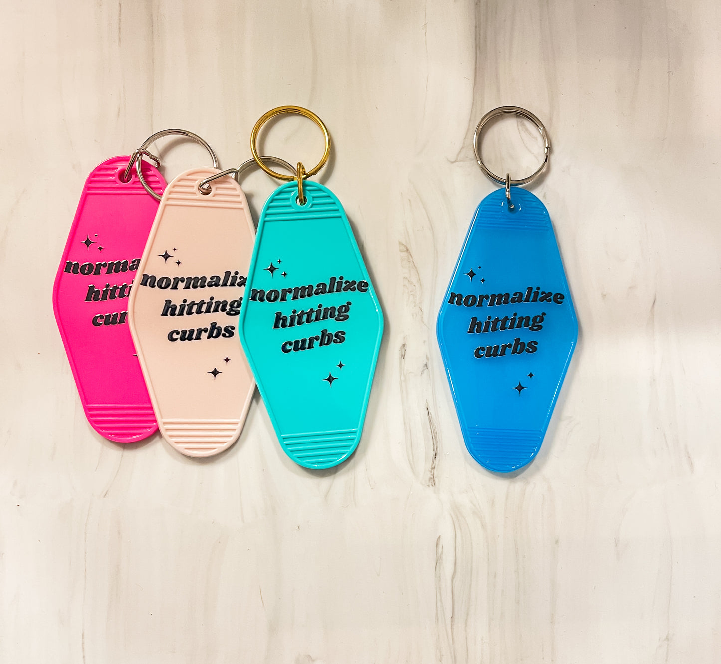 Normalize hitting curbs |Motel Keychains
