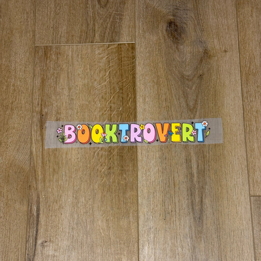 Colorful Booktrovert screen print transfer for finished apparel. Book lovers